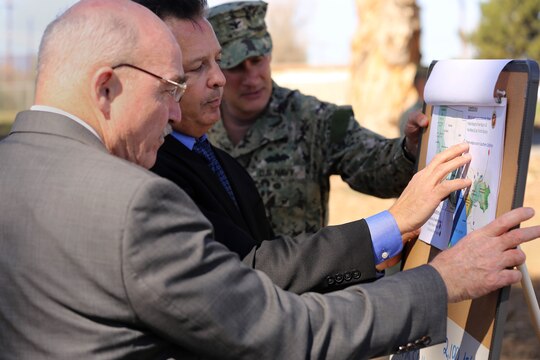 Assistant Secretary of the Navy-Energy, Installations and Environment, Dennis McGinn speaks to John Simpson about the water reservoir known as Lake O'neill during McGinn's visit to Camp Pendleton Feb. 13.
Assistant Secretary of the Navy-Energy, Installations and Environment, Dennis McGinn, visited Camp Pendleton to view the energy projects on base and to speak about energy goals for the future.  
Simpson is the director of the Office of Water Resources.