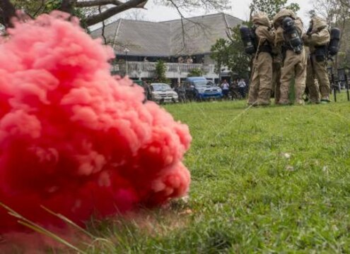 U.S. and Royal Thai Air Force chemical, biological, radiological, nuclear defense specialists work together to contain a cylinder releasing simulated toxic gas during the counter weapons of mass destruction exercise aboard Wing One Royal Thai Air Force Base, Nakhon Ratchasima, Kingdom of Thailand, Feb. 16 during Exercise Cobra Gold 2014. CG 14 is a joint, multinational exercise conducted annually in the Kingdom of Thailand aimed at enhancing and increasing mission readiness and multinational interoperability. The U.S. service members are with 1st Marine Aircraft Wing, III Marine Expeditionary Force.

