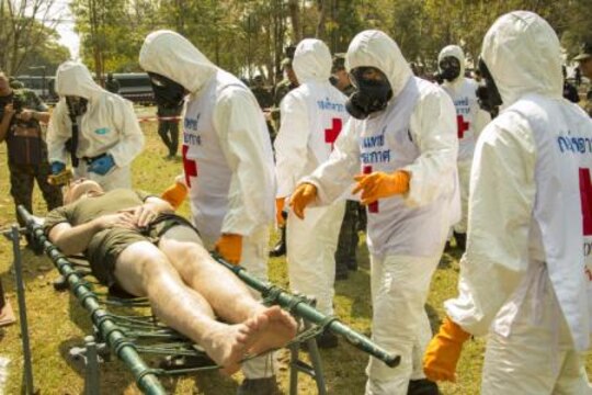 Royal Thai service members decontaminate a U.S. service member who was a mock victim from a simulated chemical terrorist attack during the counter weapons of mass of destruction exercise aboard Wing One Royal Thai Air Force Base, Nakhon Ratchasima, Kingdom of Thailand, Feb. 16 during Exercise Cobra Gold 2014. CG 14 is a joint, multinational exercise conducted annually in the Kingdom of Thailand aimed at enhancing and increasing mission readiness and multinational interoperability. The U.S. service member is with 1st Marine Aircraft Wing, III Marine Expeditionary Force.
