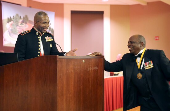 Lt. Gen. Ronald L. Bailey receives a donation toward the Montford Point Marines Memorial Project during  the Montford Point Marine Association’s 26th annual Heritage Dinner Dance at the Marston Pavilion aboard Marine Corps Base Camp Lejeune, Feb. 22. More than $2,000 was donated during the event.  