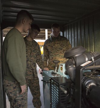 Marines with combat engineer company, Marine Wing Support Squadron 171, ensure a generator is performing properly aboard Marine Corps Air Station, Iwakuni, Japan, Jan. 15, 2014, in preparation to participate in Exercise Cobra Gold. Exercise Cobra Gold is a multinational joint exercise conducted annually in Thailand and is comprised of forces from participating nations including: Thailand, Singapore, Indonesia, Japan, South Korea, Malaysia, and the United States. China will also participate in the exercise as an observing nation.