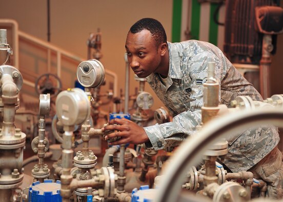 Air Force Airman 1st Class Kevin Yator, a utilities journeyman assigned to the 380th Expeditionary Civil Engineer Squadron, does an annual inspection of pressure gauges on a fuel system. (U.S. Air Force photo by Staff Sgt. Michael Means/Released) 