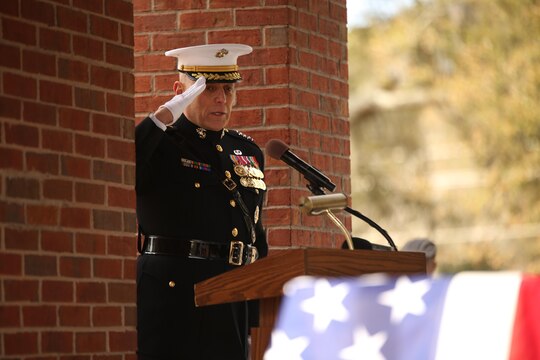 Gen. John Paxton Jr., assistant Commandant of the Marine Corps, salutes the casket of Medal of Honor recipient John James McGinty III, on Jan. 23, 2014, after speaking at McGinty’s funeral held at Beaufort National Cemetery in Beaufort, S.C. McGinty, a decorated Vietnam War hero and Parris Island veteran, died Jan. 17, 2014, in his home in Beaufort at the age of 73.