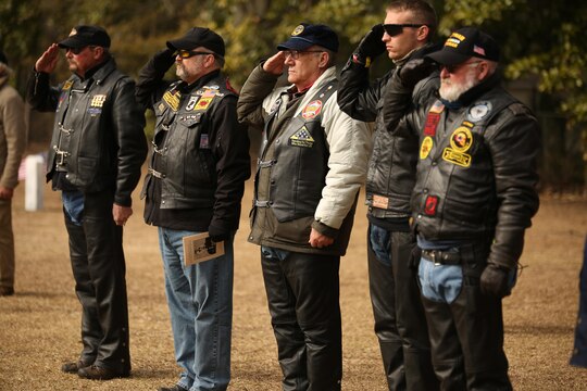 Members of the Combat Veterans Motorcycle Association salute the casket of Medal of Honor recipient John James McGinty III, during his funeral Jan. 23, 2014, at Beaufort National Cemetery in Beaufort, S.C. McGinty, a decorated Vietnam War hero and Marine Corps Recruit Depot Parris Island veteran, died Jan. 17, 2014, in his home in Beaufort at the age of 73.