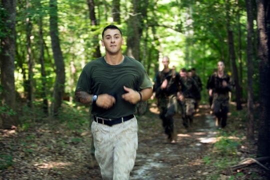 A Navy Junior Reserve Officers' Training Corps instructor leads cadets through an endurance course aboard Marine Corps Base Camp Lejeune, June 17. The cadets participated in a week-long exercise to experience the different aspects of the Corps.