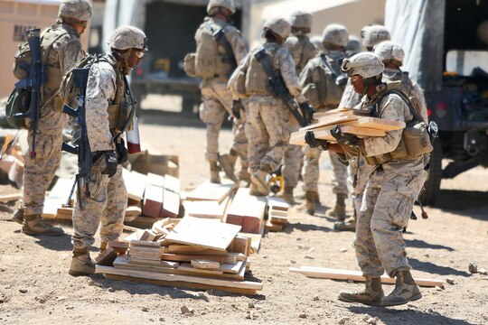 Marines from Engineer Support Company, Combat Logistics Battalion 1, Combat Logistics Regiment 1, 1st Marine Logistics Group, build ladders for guard posts during the Marine Readiness Exercise aboard Marine Corps Air Ground Combat Center Twenty-nine Palms, Calif., March 25, 2014. The MRX is part of the month-long Integrated Training Exercise 3-14 that prepares the battalion for its role, as the logistics combat element, in the final combat deployment in support of Operation Enduring Freedom.