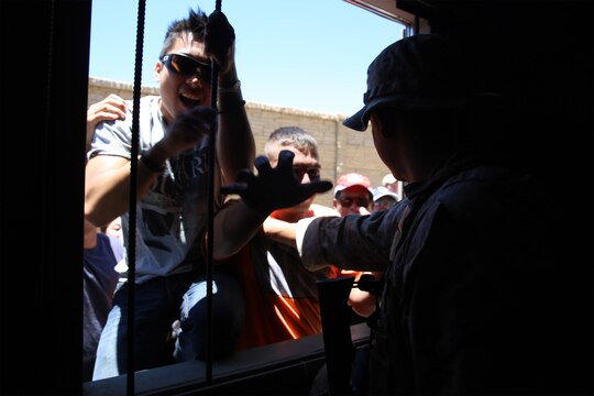 A Marine with Combat Logistics Battalion 15, 1st Marine Logistics Group, attempts to secure a medical aid station while surrounded by an increasingly belligerent crowd of role-players during a humanitarian aid exercise as part of CLB-15’s pre-deployment training with the Special Operations Training Group, 1st Marine Expeditionary Force, aboard Camp Pendleton, Calif., July 16, 2014. The exercise took place over the course of three days, and provided CLB-15 with a realistic and immersive experience. The simulation, set up by SOTG with the help of the USAID, put CLB-15’s Marines and sailors in the middle of a typhoon-ravaged rural Philippine area where they were tasked with providing humanitarian aid and disaster relief, similar to the situation faced by Marines with the 3rd Marine Expeditionary Force during the aftermath of Typhoon Haiyan in 2013. CLB-15 is slated to deploy with the 15th Marine 
Expeditionary Unit, 1st Marine Expeditionary Force. 
