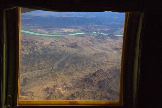 A KC-130J Hercules flown by pilots with Marine Aerial Refueler Transport Squadron (VMGR) 352 “Raiders” flies over mountainous terrain during low-level tactical navigation training outside of Yuma, Ariz., July 24. The training allowed pilots to earn qualifications, known as codes, under the instruction of a flight commander.