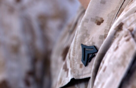 The rank insignia pinned to a Marine’s collar signifies his newly attained rank as a corporal of Marines during a three-day Committed and Engaged Leadership Indoctrination Course aboard Marine Corps Air Station Miramar, Calif., June 3-5. Newly promoted corporals attend the course to learn foundations of leadership and responsibilities.