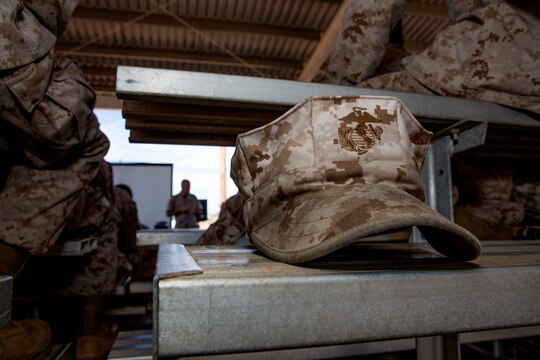 A Marine’s cover sits on a bleacher during a question and answer portion of a three-day Committed and Engaged Leadership Indoctrination Course aboard Marine Corps Air Station Miramar, Calif., June 3-5. Maj. Gen. Steven Busby, 3rd MAW commanding general, implemented the course to teach new 