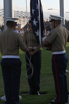 Marines retire the colors during an evening colors ceremony aboard Marine Corps Air Station Miramar, Calif., June 10. The ceremony recognized the San Diego Chargers for their service to military members in surrounding communities. The event featured 3rd Marine Aircraft Wing and MCAS Miramar noncommissioned officers as part of the Committed and Engaged Leadership initiative, originated by Maj. Gen. Steven Busby, 3rd MAW commanding general.