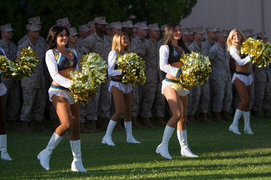 San Diego Chargers cheerleaders perform at an evening colors ceremony aboard Marine Corps Air Station Miramar, Calif., June 10. The ceremony recognized the San Diego Chargers for their service to military members in surrounding communities. The event featured 3rd Marine Aircraft Wing and MCAS Miramar noncommissioned officers as part of the Committed and Engaged Leadership initiative, originated by Maj. Gen. Steven Busby, 3rd MAW commanding general.