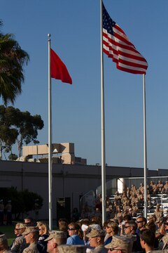 An American flag and two-star flag fly above the crowd of Marines and Sailors gathered for an evening colors ceremony aboard Marine Corps Air Station Miramar, Calif., June 10. The ceremony recognized the San Diego Chargers for their service to military members in surrounding communities. The event featured 3rd Marine Aircraft Wing and MCAS Miramar noncommissioned officers as part of the Committed and Engaged Leadership initiative, originated by Maj. Gen. Steven Busby, 3rd MAW commanding general.