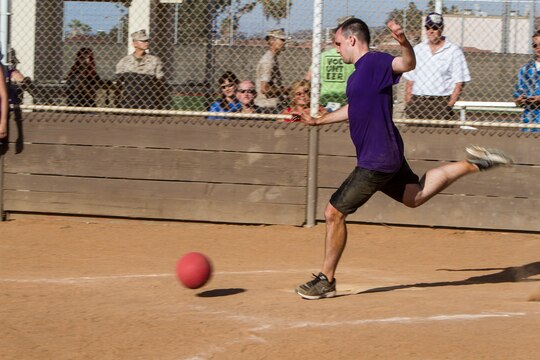 Clayton Leis, a military spouse with Marine Medium Tiltrotor Squadron (VMM) 163, kicks during his turn up at the plate during a kickball tournament aboard Marine Corps Air Station Miramar, Calif., June 14. Leis played on the Dragons team, consisting of spouses, Marines and sailors of Marine Aircraft Group 16 and Marine Fighter Attack Squadron (VMFA) 232. The Committed and Engaged Spouses’ Sports League was developed as part of Commanding General Maj. Gen. Steven Busby’s Committed and Engaged Spouse initiative. The initiative highlights military spouses for their service and sacrifice, and works to develop opportunities for camaraderie.