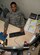 Tech. Sgt. Christopher Carter, 386th Expeditionary Logistics Readiness Squadron NCO in charge of passenger travel, works on the stack of requests for passenger travel. His office gets approximately 25 to 30 requests per day.  Carter deployed from 374th Logistic Readiness Squadron, Yokota Air Base, Japan in support of Operation Enduring Freedom.  He is a native of San Diego, California. (U.S. Air Force photo by Staff Sgt. Jeremy Bowcock)