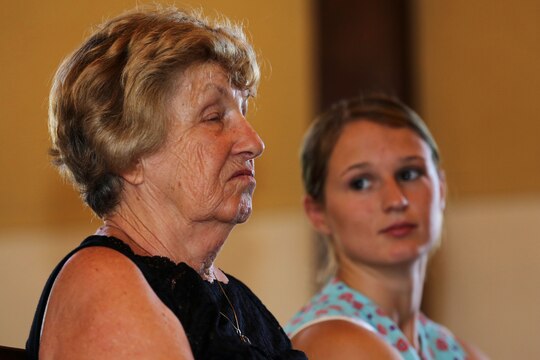 Elizabeth Smith weeps as she listens to her son, Daniel Caruso, share his warm feelings about his father, Sgt. Matthew Caruso, with a congregation of more than 100 Marines, sailors and civilian friends and family during the rededication of the Caruso Chapel, at the School of Infantry-West, here, June 23.

The chapel was initially dedicated to Caruso in 1953 and he was awarded the Silver Star Medal in 1950 for shielding father Connie Griffin, a chaplain then assigned to the 7th Marine Division (reinforced), from enemy fire with his body during an ambush in the Korean War, Dec. 6, 1950.

“He’s been a wonderful son and I’ve been very proud of him,” said Smith. “The ceremony was stirring and it’s such an honor to be here. My husband made a tremendous sacrifice.”
