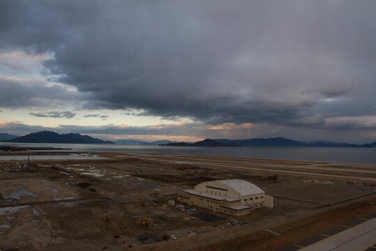 A single hangar rests above recently reclaimed land Dec. 12, 2011, aboard Marine Corps Air Station Iwakuni, Japan. In order to relocate the station’s runway a kilometer farther from Iwakuni City, the Iwakuni Runway Relocation Project, as it has come to be known, required construction workers to “reclaim” approximately 500 acres of land from the sea. In order to accomplish this task, workers used ‘earth’ removed from Atago Mountain to reclaim the area for the runway relocation project.  