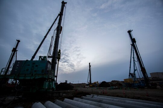 Construction equipment towers above Marine Corps Air Station Iwakuni, Japan, Dec. 14, 2013, at the future site of new bachelor officers’ quarters. During the peak of construction, workers utilized dozens of cranes and other equipment, making them a regular fixture within the gates of MCAS Iwakuni.   