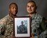 Deployed photo of U.S. Air Force Staff Sgt. Mark Bush and Senior Airman Esteban Salazar holding a photograph of their friend, Kevin Brunais. (U.S. Air Force photo by Staff Sgt. Jeremy Bowcock)
