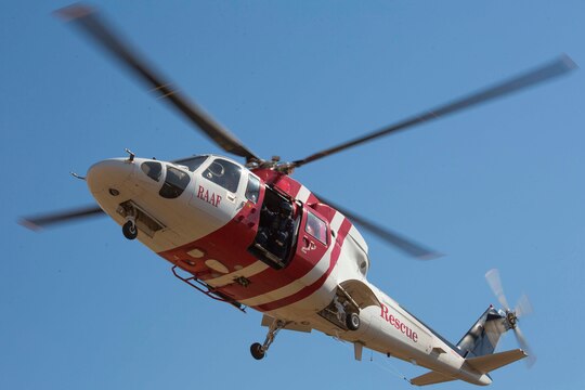 A Sikorsky S-76 search-and-rescue helicopter hovers over a landing zone during a SAR training exercise aboard Royal Australian Air Force Base Tindal, Australia, during Exercise Southern Frontier 2014, June 11. Southern Frontier is an annual bilateral training exercise between the RAAF and the United States Marine Corps w ith a primary focus on offensive air support and enhancing military interoperability.