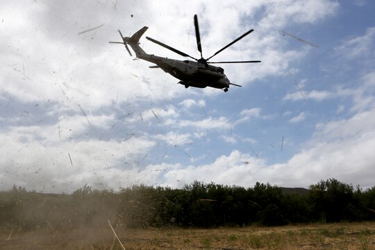 A CH-53E Super Stallion with Marine Heavy Helicopter Squadron (HMH) 465 gains altitude while transporting Marines to an objective area during training aboard Marine Corps Base Camp Pendleton, Calif., June 27. The insertion and extraction training allows Marines to enter and exit an objective area quickly from miles away.