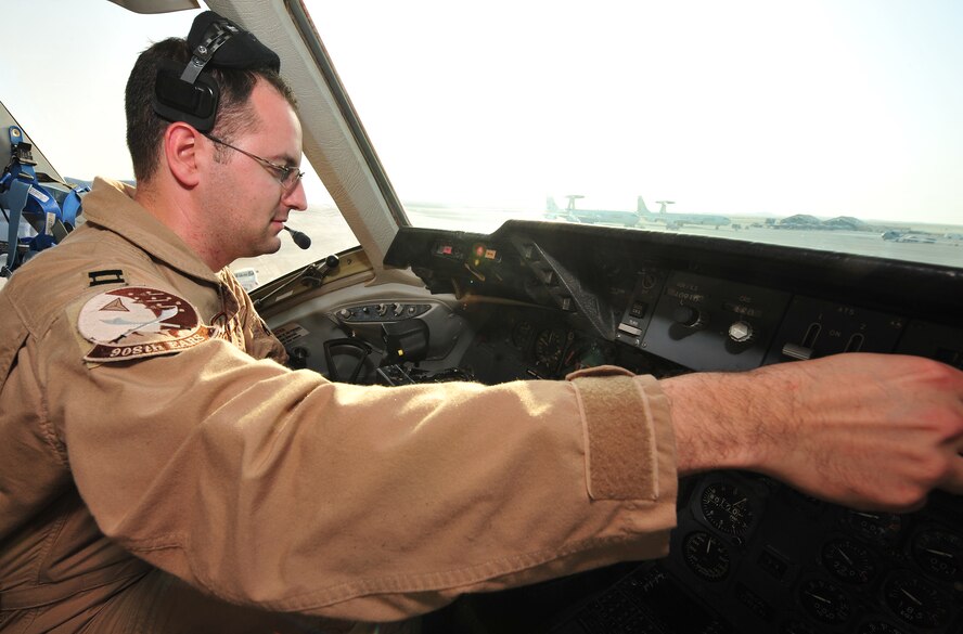 Capt. Sebastien Dauby, 908th Expeditonary Air Refueling Squadron pilot, performs preflight checks on a KC-10 Extender at an undisclosed location in Southwest Asia, March 7, 2014. (U.S. Air Force photo by Staff Sgt. Michael Means/Released)