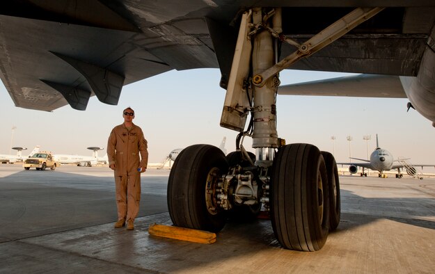 Senior Airman Christopher Wampler, 908th Expeditionary Air Refueling Squadron flight engineer, performs a walk-around on a KC-10 Extender at an undisclosed location in Southwest Asia, March 7, 2014. (U.S. Air Force photo by Staff Sgt. Michael Means/Released)