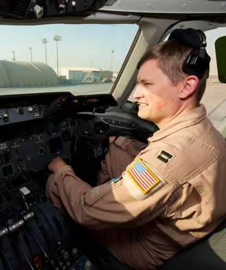 Capt. Tim Farwell, 908th Expeditionary Air Refueling Squadron pilot, performs preflight checks on a KC-10 Extender at an undisclosed location in Southwest Asia, March 7, 2014. (U.S. Air Force photo by Staff Sgt. Michael Means/Released)