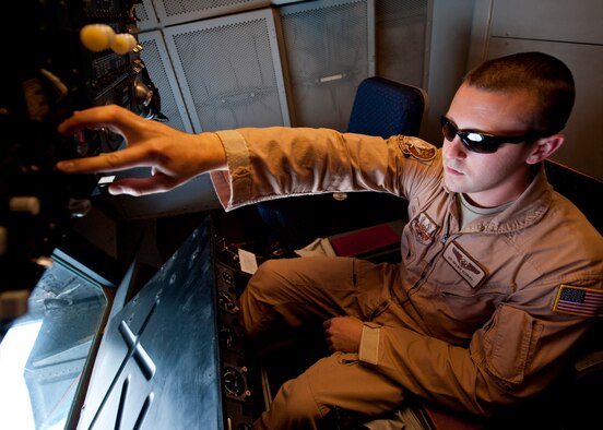 Senior Airman Shawn Aldrich, 908th Expeditionary Air Refueling Squadron boom operator, performs preflight checks on a KC-10 Extender at an undisclosed location in Southwest Asia, March 7, 2014. (U.S. Air Force photo by Staff Sgt. Michael Means/Released)