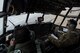 An Afghan Air Force pilot and U.S. Air Force Maj. Chris Garcia, 438th Air Expeditionary Wing/NATO Air Training Command-Afghanistan C-130 Hercules adviser, fly an advisory mission March 10, 2014, near Kabul, Afghanistan. Garcia, a Danville, Ind., native, is deployed from the 53rd Airlift Squadron, Little Rock Air Force Base, Ark. Airmen of the 438th AEW/NATC-A play a vital role in Operation Enduring Freedom as advisers tasked with aiding the Afghan government in establishing an operational and sustainable Afghan air force. (U.S. Air Force photo by Tech. Sgt. Jason Robertson/Released)