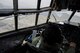 An Afghan Air Force pilot flies a AAF C-130 Hercules during an advisory mission with U.S. Air Force airmen from 438th Air Expeditionary Wing/NATO Air Training Command-Afghanistan March 10, 2014, over Kabul, Afghanistan. Airmen of the 438th AEW/NATC-A play a vital role in Operation Enduring Freedom as advisers tasked with aiding the Afghan government in establishing an operational and sustainable Afghan air force. (U.S. Air Force photo by Tech. Sgt. Jason Robertson/Released)