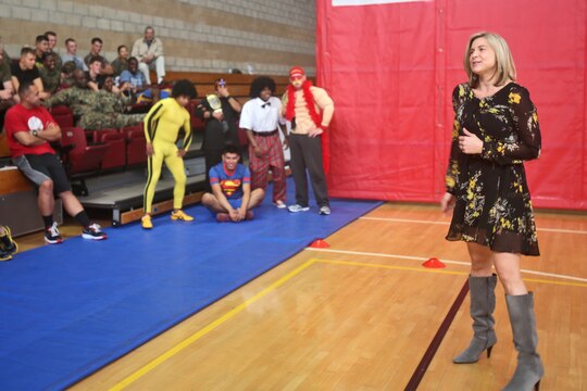 Meredith Lozar, director of the Navy and Marine Corps Relief Society, Marine Corps Base Camp Pendleton, Calif., speaks to Marines during a dodgeball fundraising tournament to increase awareness for the organization and raise funds, March 3, 2014. The NMCRS provides grants and zero-interest loans to Marines in need allowing them to focus on their jobs and alleviate the financial stress they may face at home.