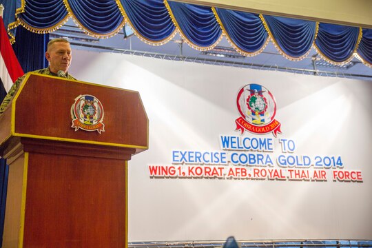 Col. Daniel Wilson, chief of staff for 3rd Marine Division, III Marine Expeditionary Force, addresses service members, both U.S. and Thai, about what is expected from them and their goal during the opening ceremony for Exercise Cobra Gold 2014 aboard Wing One Royal Thai Air Force Base, Nakhon Ratchasima, Kingdom of Thailand, Feb. 9. CG 14 is a joint, multinational exercise conducted annually in the Kingdom of Thailand aimed at enhancing and increasing multinational interoperability.
