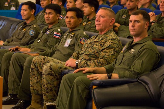 From right to left, Lt. Col. William Sheridan, executive officer for Marine Aircraft Group 12, 1st Marine Air Wing, III Marine Expeditionary Force, Col. Daniel Wilson, chief of staff for 3rd Marine Division, III MEF, and Group Captain Ponlawat Intarawised, deputy commander for Wing One, Royal Thai Air Force, sit together during the opening ceremony for Exercise Cobra Gold 2014 aboard Wing One Royal Thai Air Force Base, Nakhon Ratchasima, Kingdom of Thailand, Feb. 9. CG 14 is a joint, multinational exercise conducted annually in the Kingdom of Thailand aimed at enhancing and increasing multinational interoperability.