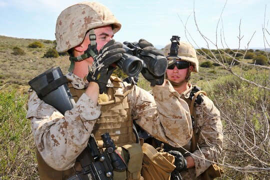 Lance Cpl. Jesse L. King (left), combat engineer, Alpha Company, 7th Engineer Support Battalion, 1st Marine Logistics Group, and Lance Cpl. Caleb J. Smith, combat engineer, Alpha Company, conduct area and route reconnaissance during the company’s super squad competition aboard Camp Pendleton, Calif., March 12, 2014. Eight squads, of approximately 80 Marines and sailors, from Alpha Company participated in the weeklong competition that focused on infantry rifle squad skills, tested small-unit leadership and their combat-readiness. King, 21, is from Chicago. (U.S. Marine Corps photo by Cpl. Timothy Childers / Released)