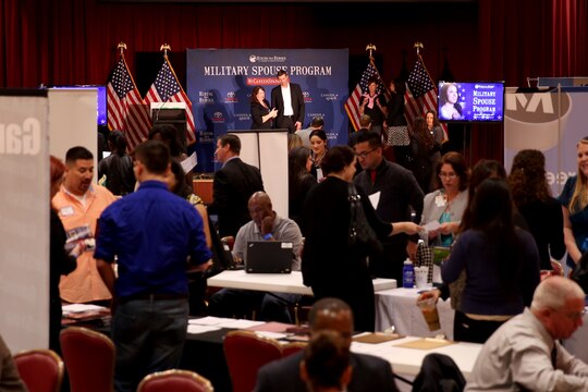 Military spouses network with employers, receive help with resume writing and career planning during the Hiring Our Heroes hiring fair at the Pacific Views Event Center, March 25. The new website, MyCareerSpark.org, was introduced at the fair and provides a resume builder to help military spouses eliminate employment gaps and translate skills.

