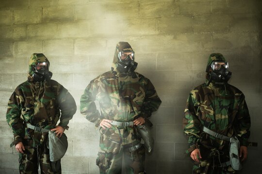Marines with 3rd Radio Battalion listen to instructions being given during their annual gas chamber training at Boondocker Training Area, March 25, 2014. (U.S. Marine Corps photo by Lance Cpl. Matthew Bragg)