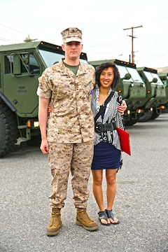 Lance Cpl. Gabriel R. Gehr, electrical equipment system technician with Utilities Platoon, Engineer Maintenance Company, 1st Maintenance Battalion, 1st Marine Logistics Group, poses with his wife, Kaitlyn, after receiving the Purple Heart aboard Camp Pendleton, Calif., May 5, 2014. More than a year earlier on Nov. 20, 2013, Gehr sustained shrapnel injuries from an anti-tank rocket while supporting Operation Enduring Freedom. Gehr, 21, is from Delphos, Ohio.