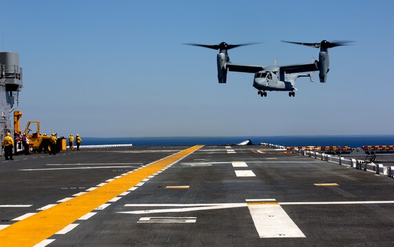 Pilots with Marine Medium Tiltrotor Squadron (VMM) 161 land an MV-22B Osprey on the flight deck during field carrier landing practices aboard the USS Essex, May 15. Pilots and crews train before missions like this to work in unison landing the aircraft aboard the vessel without damaging the Essex’s superstructure.