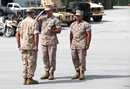 Sgt. Maj. Tracy A. Linch, outgoing sergeant major of 2nd Marine Special Operations Battalion renders a salute to Lt. Col. Benjamin J. Pappas, commanding officer, 2nd MSOB, prior to relinquishing his post and transferring the noncommissioned officer’s sword to Sgt. Maj. Edwin A. Mota, incoming sergeant major, 2nd MSOB, during a Relief and Appointment Ceremony at the 2nd MSOB headquarters, May 29.