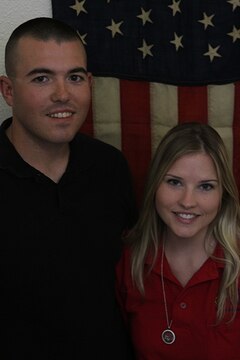 Cpl. Jesse Tingle, a musician with the 3rd Marine Aircraft Wing Band, and his wife, Morgan Tingle, pose in front of a 45-star flag in their home, aboard Marine Corps Air Station Miramar, Calif., May 11. Jesse Tingle and his wife, Morgan Tingle, share a love of history through their hobbies and occupations. Jesse Tingle collects historical American flags. Morgan Tingle volunteers with the Flying Leatherneck Aviation Museum aboard MCAS Miramar.