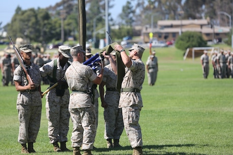 1st Transportation Support Battalion, Sergeant Major, 1st Sergeant Charles P. Berglund assists the Battalion Commander, Lieutenant Colonel Thomas M. Warren uncase the National Colors during 1st Transportation Support Battalion’s activation ceremony on 1 October 2014.