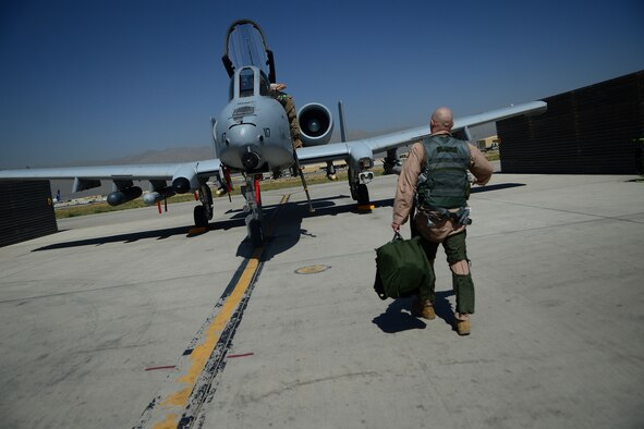 U.S. Air Force Maj. Vincent Sherer, 455th Air Expeditionary Wing pilot, walks toward  an A-10 Thunderbolt II aircraft at Bagram Airfield, Afghanistan Aug. 5, 2014.  Sherer has been flying for 12 years and has deployed to Bagram four times.  He is deployed from Davis-Monthan Air Force Base, Ariz. and a native of Portland, Ore. (U.S. Air Force photo by Staff Sgt. Evelyn Chavez/Released)