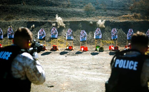 CAMP PENDLETON, Calif. - Marines with the Provost Marshall Office's Special Reaction Team, engage targets holding hostages during a live-fire training evolution at Range 300, Oct. 23.  The SRT is responsible for any critical situations that fall beyond the capabilities of ordinary law enforcement. (U.S. Marine Corps photo by Cpl. Keenan Zelazoski)