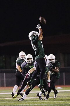 CAMP PENDLETON, Calif. - The Marine Corps Base Spartans secured their spot in the semi-finals with a dominant 38-0 win over the School of Infantry Outlaws during their first game of the playoffs here, Oct. 27. (U.S. Marine Corps photo by Cpl. Shaltiel Dominguez)