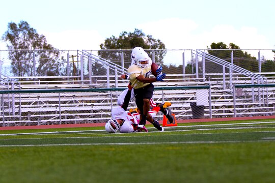 The 1st Light Armored Reconnaissance Battalion Highlanders claimed a hard-fought 20-14 victory over the Headquarters and Support Battalion Spartans at the Paige Fieldhouse football field here, Sept. 8.