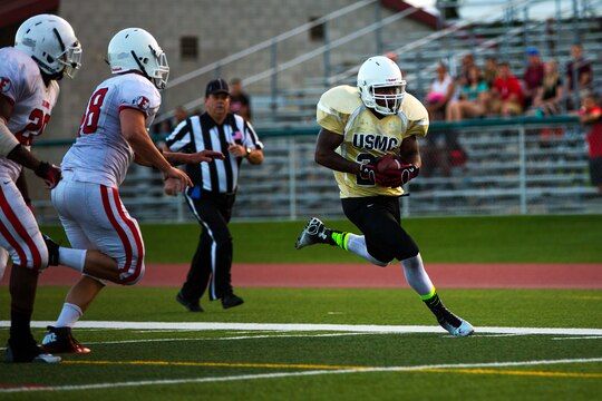 The 1st Light Armored Reconnaissance Battalion Highlanders claimed a hard-fought 20-14 victory over the Headquarters and Support Battalion Spartans at the Paige Fieldhouse football field here, Sept. 8.