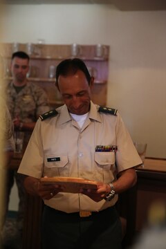 Brigadier Gen. Leonardo Pinto Morales, commander of the 7th Division of the Colombian Army, is presented a plaque as part of the Colombian Observance Exchange Program Sept. 2, 2014, aboard Camp Pendleton, Calif. More than thirty officers of the Colombian School of Advanced Warfighting visited 1st MLG to allow members of both the U.S. Marine Corps and Colombian Armed Forces to build an understanding of services, share best practices and strengthen camaraderie and interoperability. (U.S. Marine Corps photo by Staff Sgt. Lynn Kinney/released)
