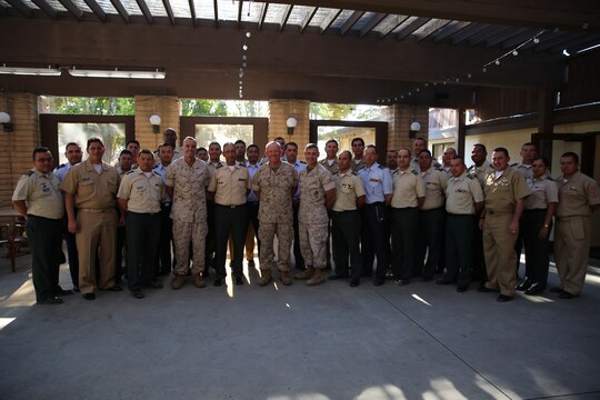 Major Gen. Vincent A. Coglianese, 1st Marine Logistics Group Commanding General, Brig. Gen. Leonardo Pinto Morales, commander of the 7th Division of the Colombian Army, Maj. Gen. Lawrence D. Nicholson, 1st Marine Division commanding general, and various leaders within the MLG and Colombian Armed Forces pose for a group picture as part of the Colombian Observance Exchange Program Sept. 2, 2014, aboard Camp Pendleton, Calif. More than thirty officers of the Colombian School of Advanced Warfighting visited 1st MLG to allow members of both the U.S. Marine Corps and Colombian Armed Forces to build an understanding of services, share best practices and strengthen camaraderie and interoperability. (U.S. Marine Corps photo by Staff Sgt. Lynn Kinney/released)