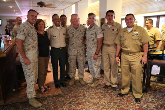 Major Gen. Vincent A. Coglianese, 1st Marine Logistics Group Commanding General, Brig. Gen. Leonardo Pinto Morales, commander of the 7th Division of the Colombian Army, Maj. Gen. Lawrence D. Nicholson, 1st Marine Division commanding general, Col. Phil Frietze, G-3 operations officer, 1st MLG, and other leaders within the Colombian Armed Forces pose for a picture as part of the Colombian Observance Exchange Program Sept. 2, 2014 aboard Camp Pendleton, Calif. More than thirty officers of the Colombian School of Advanced Warfighting visited 1st MLG to allow members of both the U.S. Marine Corps and Colombian Armed Forces to build an understanding of services, share best practices and strengthen camaraderie and interoperability. (U.S. Marine Corps photo by Staff Sgt. Lynn Kinney/released)